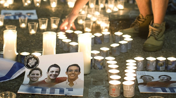 Photo of three Israeli teenagers who were abducted and murdered by a group of Palestinians. Tel Aviv's Rabin Square June 30, 2014. (Reuters/Nir Elias)